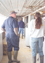 A group touring a barn.